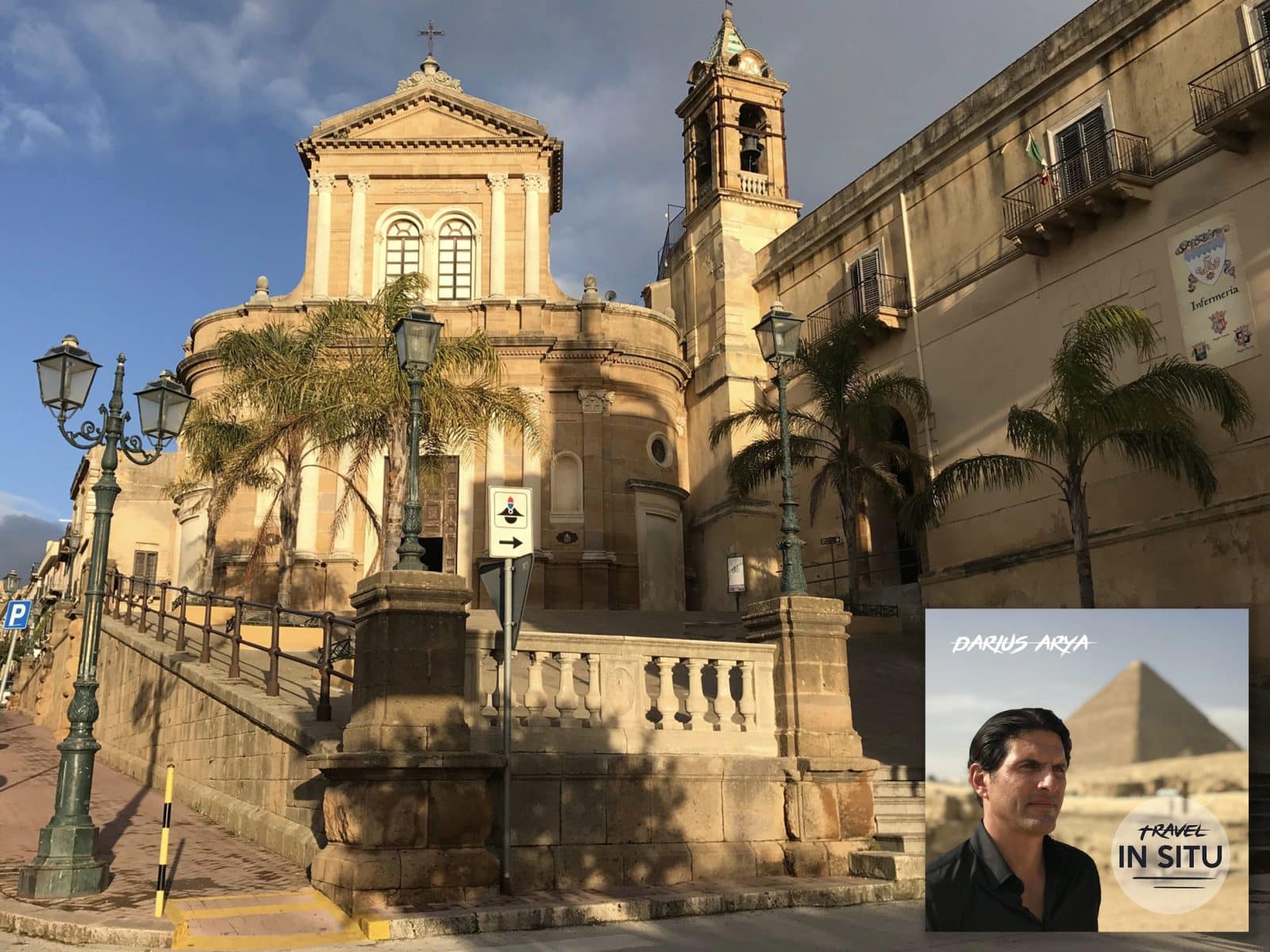Historic Mediterranean church with palm trees and street lamps in foreground; inset shows a man’s portrait with pyramid, labeled “Darius Arya, Travel In Situ.”.