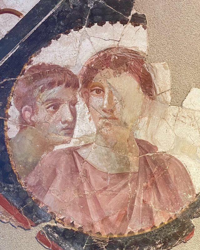 Fragment of an ancient Roman fresco depicting a man and a woman.
