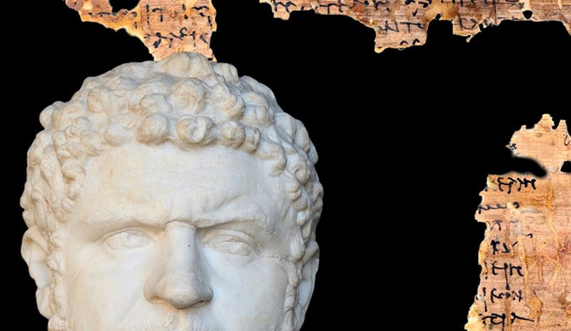 Marble bust of a bearded man in front of a torn ancient manuscript with Greek writing on a black background.